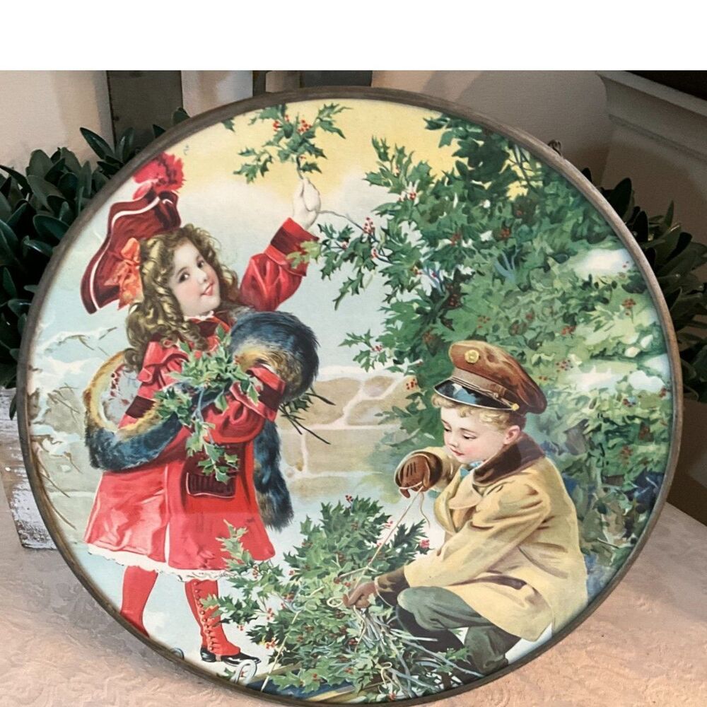 Gorgeous vintage Victorian era flue cover boy and girl with holly tree Christmas